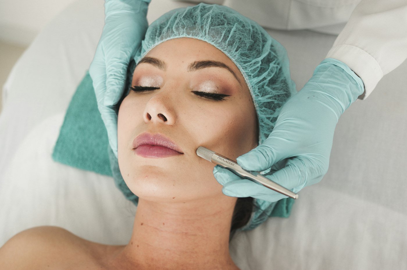 Esthetician performing a facial treatment on a client